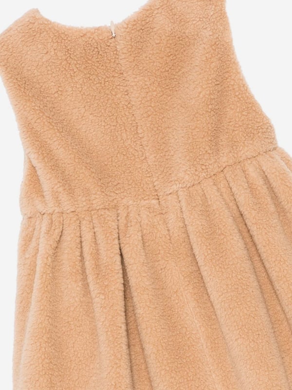 Fendi incorporate passion and energy into their meticulously crafted designs. This baby girls desert sand dress is reflective of the Italian label's high attention to detail. Engineered in a timeless faux fur design. It showcases a beautiful tone-on-tone embroidered logo on the front. The flared skirt and lined interior are depicted with all-over tobacco-coloured details for a distinctive designer finish.‚ Made in Italy‚ Concealed Zip Back Closure‚ Crew Neck‚ Long Sleeves‚ Curved Hem‚ 34% Cotton; 34% Virgin Wool; 32% Polyester