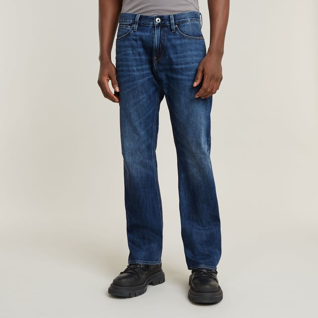 Zip fly. 5 pockets, incl. coin pocket caught in the seam. Tool loop at the side. G-Star RAW label at the back, made from a leather-like paper fabric. Zip & button closure. Mid waist. The Lenney jeans is designed in a straight fit that widens in a bootcut silhouette. The tool loop at the side adds interest. 100% Cotton. Rigid. Weight 11.3 oz. Bootcut