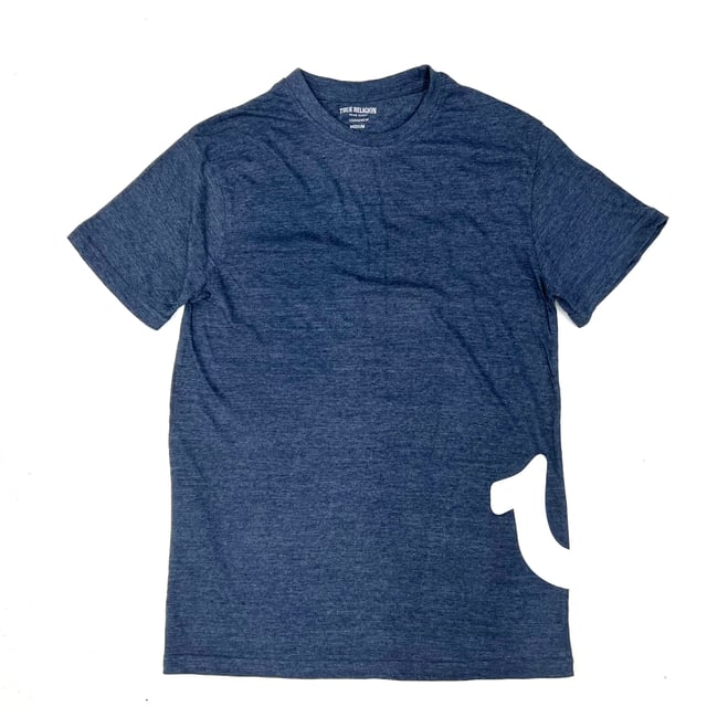 True Religion loungewear tee in heather dress blue features a big horseshoe logo on the side of the body. Made with a soft cotton/poly blend, and has a crew neckline & short sleeves.