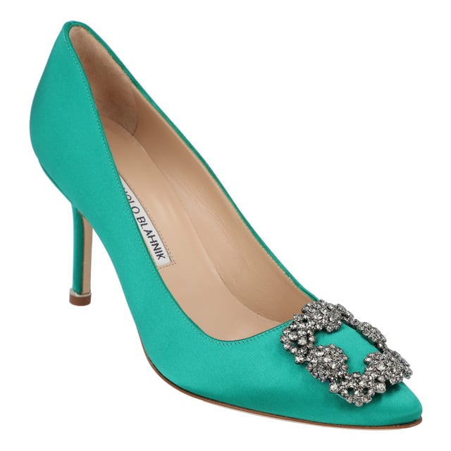 Satin almond toe pumps featuring a square crystal buckle encased in a gunmetal frame. Finished with a stiletto mid heel.

Upper: 68% viscose, 32% silk.
Sole: 100% cow leather.
Lining: 100% kid leather.
Heel measures 90 mm.
Made in Italy.