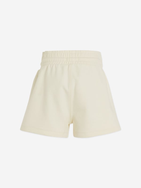 Indulge in the luxury of Calvin Klein with our stylish Girls Monogram Embroidered Shorts in Beige. Essential for any young fashionista's collection, these shorts command attention while remaining charmingly playful. Key features include: High-End Design: Evident in the chic monogram embroidery, Calvin Klein‚ unmatched craftsmanship exudes in every stitch.  Premium Quality: Tailored from fine fabric, ensuring both durability and comfort for your little girl's all-day activity. Versatile Trend: The neutral beige toned shorts easily coordinate with any top, enabling versatility in styling.Revolutionize your girl's wardrobe with these elegant designer shorts. Order now for a distinctive Calvin Klein touch in your child's outfits!
