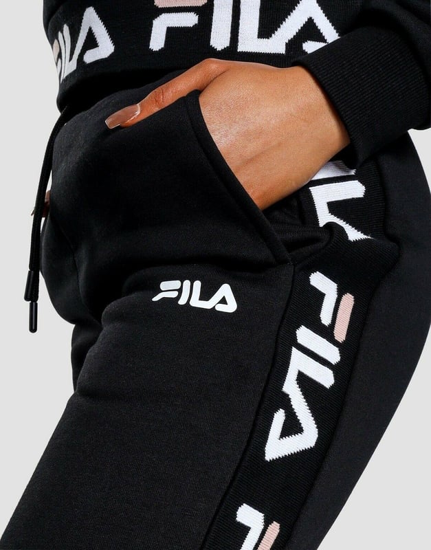 Fila Womens Jacquard Panel Joggers in a Black. 
These Soft Pants have a Luxe Feel to Them While Offering Ultra Comfort. 
These Joggers Have Elasticated Cuffs with Waistband for a Perfect Fit. 
Finished With a White and Black Fila Taping Down Both Legs and a Fila Logo to the Thigh. 
80% Cotton, 20% Polyester. 
Machine Washable.
