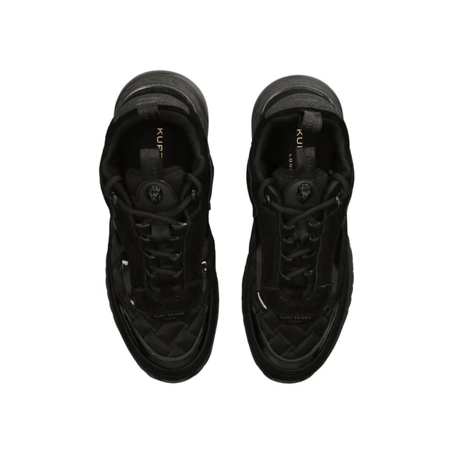 The Kurt Geiger Kensington Sneaker features a black upper in suede, satin and rubber. The tongue features a black branded monocle with black eagle head. Sole height: 4cm.