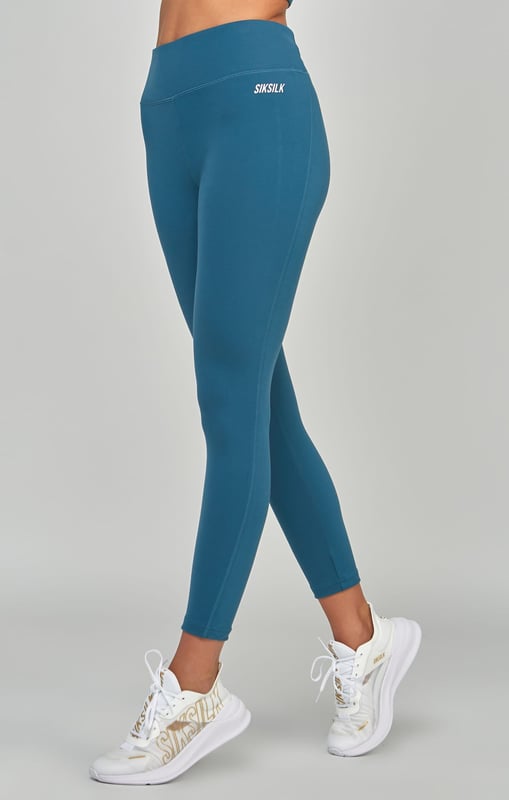 inchTeal Sports Essentials LeggingContains 30% recycled polyesterSoft touchHigh riseHigh build print logoSecure back zip pocketFlat seams for comfortMoisture wicking fabricMachine wash82% Polyester  18% Elastane inch