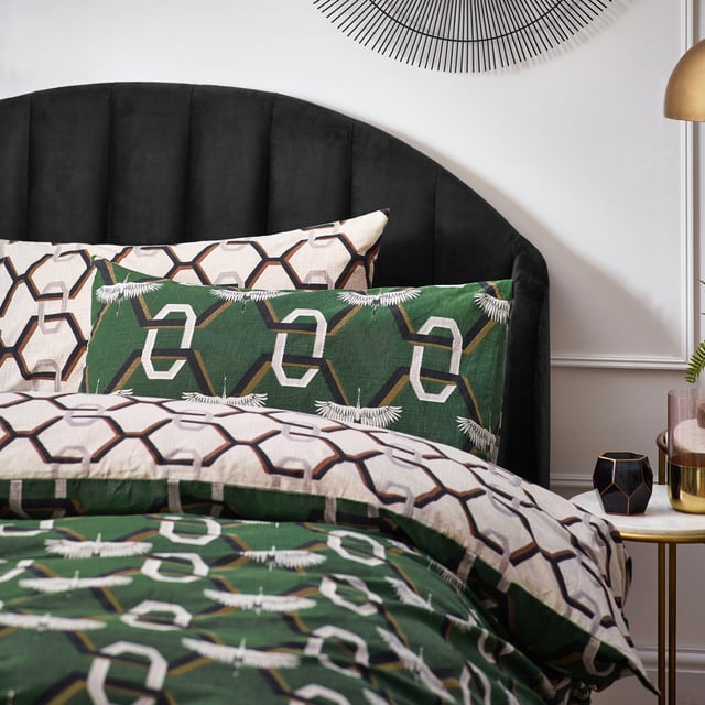 Combining iconic Art-Deco, trending geometric prints, with the timeless beauty of nature, the show-stopping, Avalon duvet cover set is a clever and impressive piece. Gleaming white cranes fly over 3D chain-links, set against a rich, jewel-toned background for a luxurious finish. Turn the duvet cover set over and the cranes have flown off, leaving just the trending Art-Deco style pattern for a modern maximalist look.