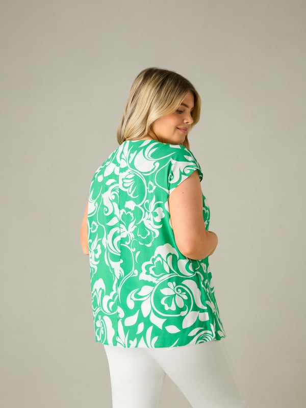 Printed all over with a pretty green paisley print, this top is cut from a lightweight woven fabric thats so comfortable. With a flattering V-neckline with a pleat, it has short sleeves for coverage, making this the perfect throw-on warm weather piece.