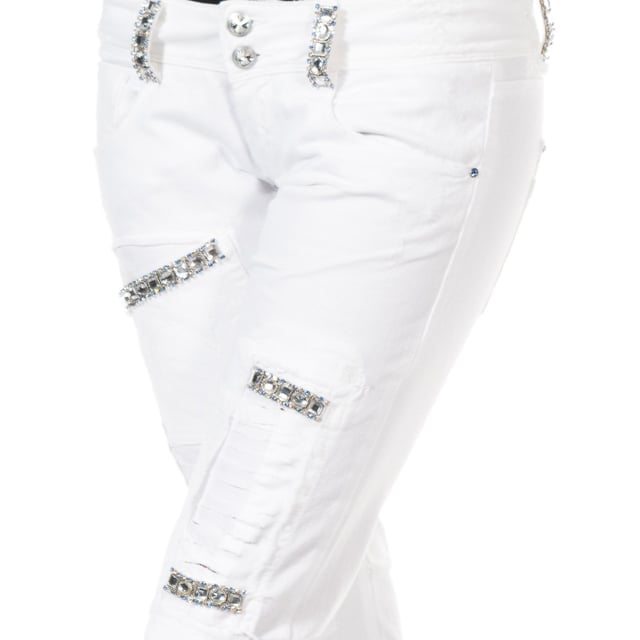 Long denim pants.
 Zipper and button closure on the front.
 Waist with belt loops.
 Loops with rhinestone application.
 Two open pockets and mini pocket on the front.
 Open pocket application with rhinestone detail on one side of the front.
 Application of patches with rhinestones.
 Custom label application by the brand, on the side of the waistband.
 Zipper and button closure application on the side of one of the bottoms.
 Skinny cut bottoms.
 Seams seen in tone.
 Composition: 97% Cotton.- 3% Elastane.
 Care:
- Wash maximum at 40ºC.
 - Iron at medium temperature, max. 110ºC.
 - Allows you to use a dryer.
 - Do not use bleach.
 - Does not support dry cleaning.