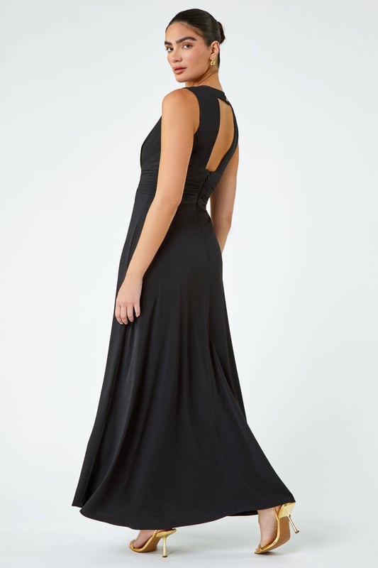 Buckle Detail Maxi Stretch Dress from Roman. Ooze Summer glamour in this gorgeous maxi dress. Detailed with a statement buckle that pulls you in at the waist, this figure flattering sleeveless shape is complimented by a deep v-neckline. Draped to a sophisticated floor length, this dress also features a stunning v back. This sophisticated maxi dress delivers a chic Summer feel. Pair with heels or sandals with a smart jacket for a seasonal Wedding or day at the races!