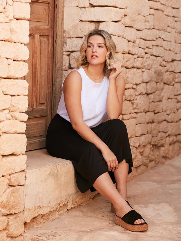 The perfect throw-on piece, this black jersey midi skirt is as flattering as it is comfortable. In a super soft, stretchy jersey, its designed to skim your curves beautifully, and has an elasticated back waistband for the perfect fit. Pair with anything from a T-shirt to a jumper for effortless daytime cool.