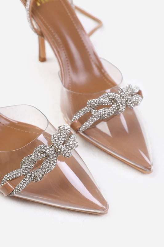 Where's That From Womens 'Monaco' Perspex Heel With Embellished Detail And Diamante Cross Strap Step into the spotlight with our Monaco Perspex Heel with Embellished Detail and Diamante Cross Strap. These stunning heels are designed to make a statement and add a touch of glamour to any outfit.
Key Features:
Effortless Style: The combination of perspex material, pointed toe, and diamante detail create a unique and eye-catching look. These high heels effortlessly elevate your style, making you the centre of attention wherever you go.
Secure Fit: The diamante heels not only add a touch of sparkle but also ensure a secure fit that hugs your foot.
Durable Construction: Made with high-quality materials, our Perspex Pointed Toe Heels are built to last. The sturdy construction and reliable stitching ensure their durability, making them suitable for any occasion.
Specifications:
Heel height: 3.5' (9 cm) approx
Toe shape: Pointed
Invest in our Monaco Perspex Heel with Embellished Detail and Diamante Cross Strap heels for a perfect combination of style, comfort, and glamour. Make a statement and turn heads wherever you go. Get yours today and step into a world of elegance and sophistication!