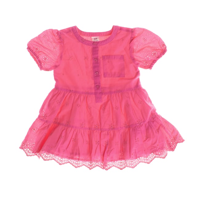 Children's dress for girls with a delicate and charming design, perfect for special occasions.

 It has a round neckline with button closure at the front, making it easy to put on.

 Short elasticated sleeves give it a feminine, fitted look, while embroidered details throughout the garment add texture and elegance.

 It includes a small chest pocket and a decorative embroidered hem at the bottom, which completes its style.

 Ideal for keeping little ones comfortable and looking adorable and refined.
 Composition: Exterior: 100% Cotton; Interior: 100% Cotton; Embroidery: 100% Polyester
 Care:
- Machine wash max. 30ºC..
 - Use similar colors in the wash.
 - Avoid the use of bleaches.
 - Dry at low temperature.
 - Iron at low temperature.
 - Do not dry clean.