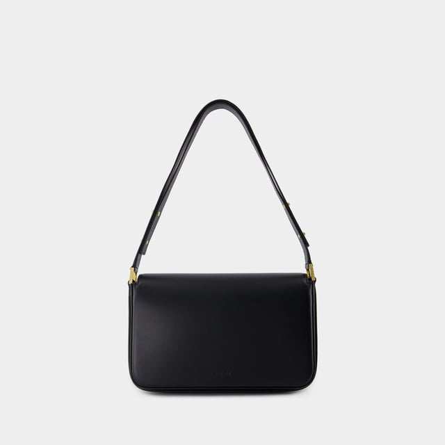 Un asa. Doble asa de transporte. Material: piel de ternero lisa. Colores: NEGRO - Negro. Piel de becerro lisa. Cierre: cierre magnético en la parte superior. Distribución interior: un bolsillo interior con cremallera y un bolsillo exterior con cremallera. Height: 19. Length: 7.