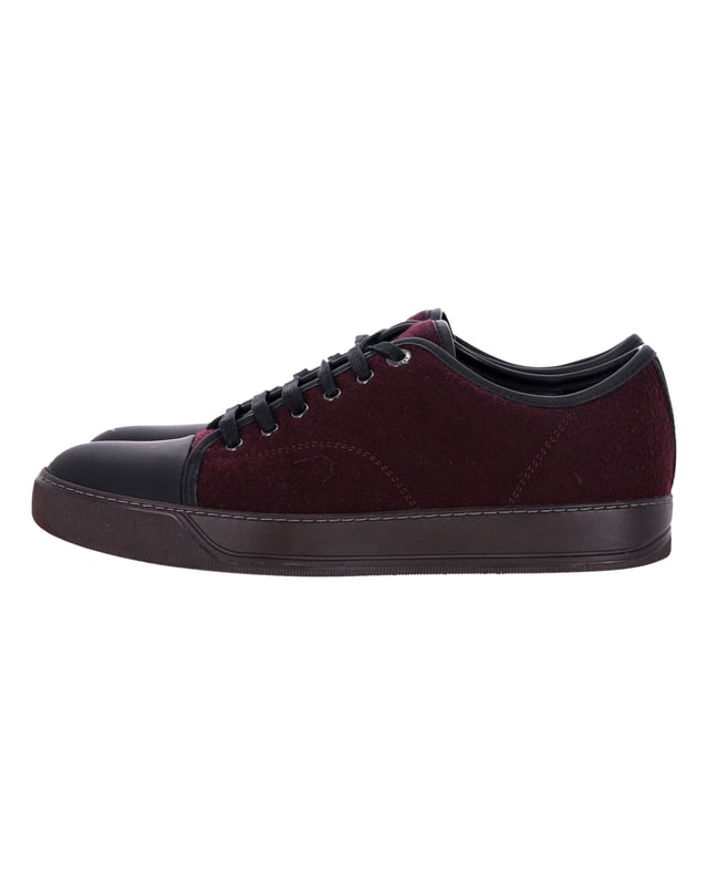 VINTAGE, RRP AS NEW
Elevate your sneaker game with the Lanvin DBB1 Matte Cap Toe Low Top Sneaker in Burgundy Suede. A true essential of the Lanvin men’s wardrobe, these sneakers are reimagined each season to offer a fresh take on a classic design. The low-top silhouette adds a casual touch, while the cap toe provides a refined, modern aesthetics. The burgundy suede material offers a sleek, sophisticated look that is perfect for any occasion. These sneakers embody the perfect blend of timeless style and contemporary flair, making them a must-have addition to any footwear collection. Make a statement with these Lanvin sneakers that seamlessly balance comfort and style.


With dust bag.

Lanvin DBB1 Matte Cap Toe Low Top Sneaker in Burgundy Suede
Color: Burgundy
Material: Suede
Condition: Very good
Size: EU40.5
Measurements: Heel height: 2; Insole length: 29
Signs of wear: Minor markings, Lightly used but very well maintained. Minor mark at soles & creasing, light scuffing at the soles and heels.
SKU: 367921