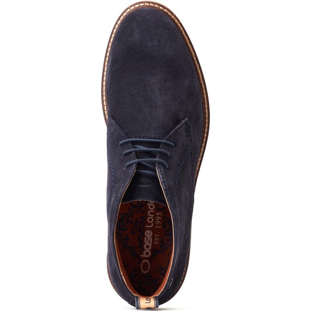 Stride in style with the Knebworth Men's Chukka Boot by Base London. Boasting premium leather uppers, a laid-back 3-lace closure, and a robust nylon pull tab for easy on/off, this Chukka boot features an Orthorlite insole for added comfort.