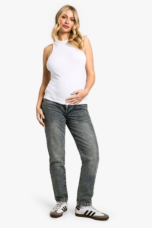 High-waisted design for comfortable support
        Relaxed mom-jean silhouette for effortless style
        Versatile denim fabric suitable for everyday wear
        Adaptable waistband to accommodate growing bump
        Classic five-pocket styling for practicality
    
    Embrace comfort and style during your pregnancy with these essential high-waisted mom jeans from Boohoo. Crafted to flatter your changing figure, these jeans offer a relaxed fit that doesn't compromise on fashion-forward appeal. The adaptable waistband ensures a snug yet comfortable fit as your bump grows, while the classic denim fabric maintains its shape wear after wear. Style these versatile jeans with a fitted tank top and trainers for a casual daytime look, or dress them up with a floaty blouse and ankle boots for family gatherings. The timeless design makes these jeans a wardrobe staple that will see you through your pregnancy and beyond, offering both comfort and confidence for all your casual occasions.