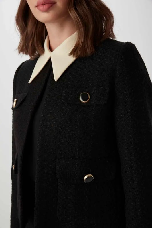 Our sizes run large, we recommend you to prefer one size smaller. Designed for those who want to easily capture a sophisticated elegance, this black Tuvit jacket is an excellent combination of classic and modern lines. This piece, where you can talk about your elegance both in business and special invitations, will be indispensable for the wardrobes. It offers practicality with functional pocket details and single -button front closing. It adds a modern atmosphere with a minimalist collar and flat cut. The deep black color adapts to all kinds of combinations. This black Tuvit jacket forms an excellent business combination with a white shirt and a black pencil skirt. When you are completed with heels and an elegant handbag, you can take your elegance to the next level.