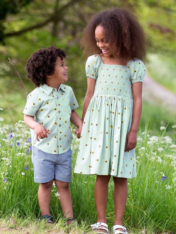 100% organic cotton | Proud to be certified to the Global Organic Textile Standard (GOTS) | Sunflower dot all-over print | Soft sage | Poplin fabric | Elasticated short sleeves | Square neck | Elasticated shirring at chest | Made in India | Machine washable at 40 degrees, or at 30 degrees to be kinder to the planet