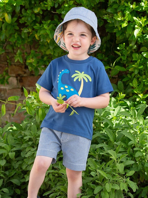 100% organic cotton | Proud to be certified to the Global Organic Textile Standard (GOTS) | Dinosaur appliqué design | OEKO-TEX Standard 100 (Product class I) appliqué backing | Navy blue | Single jersey (180-190 gsm) | Popper shoulder opening | Short sleeved | Round neck | Made in Turkey | Machine washable at 40 degrees, or at 30 degrees to be kinder to the planet