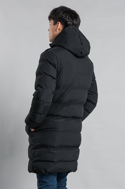 This longline funnel neck hooded padded jacket from Nines by Kensington Eastside will ensure you are kept warm on colder days. Features funnel neck, hood, zip and popper fastening, two large popper fastening pockets and two zip chest pockets, ribbed elasticated cuffs for comfort, and inside fur lining in half the jacket.