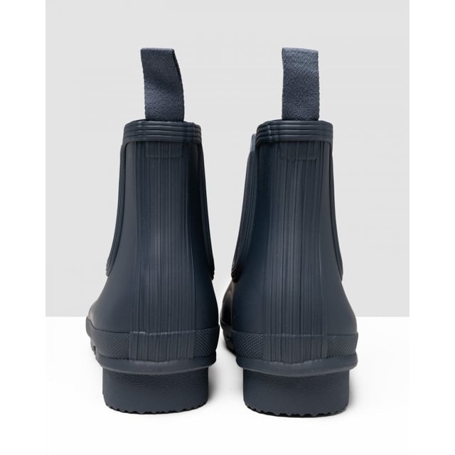 Size/Fit Summary: True to size, Regular fit which features new engineered improvements. If you are in-between sizes or want to wear a thick sock, it is recommended to size up.
The Hunter Original Chelsea Boot has been re-engineered for an improved fit and all-day comfort. A wider ankle circumference, and an increased curve in the heel and around the Achilles tendon delivers an even more comfortable fit.
The new and improved Hunter Original Chelsea Boot has an even more optimum fit to maximise all-day comfort. Ready for rain, each boot is handcrafted from natural rubber and vulcanised for superior protection. Retaining the iconic features of a traditional Chelsea, it features elasticated-gussets and has a nylon pull-tab to make stepping into the boot easy. In a classic black matte, these men's waterproof Chelsea's are a wet weather wardrobe essential.
We recommend that all Hunter Chelsea boots be worn with Hunter Chelsea socks, which have been technically designed to protect the wearer's skin from contact with rubber in specific areas.

Waterproof
Handcrafted
Waterproof
Polyester lining
Rubber outsole with Hunter Original tread pattern
Elastic side gussets and nylon pull-tab
Crafted from natural vulcanised rubber with a matte finish
