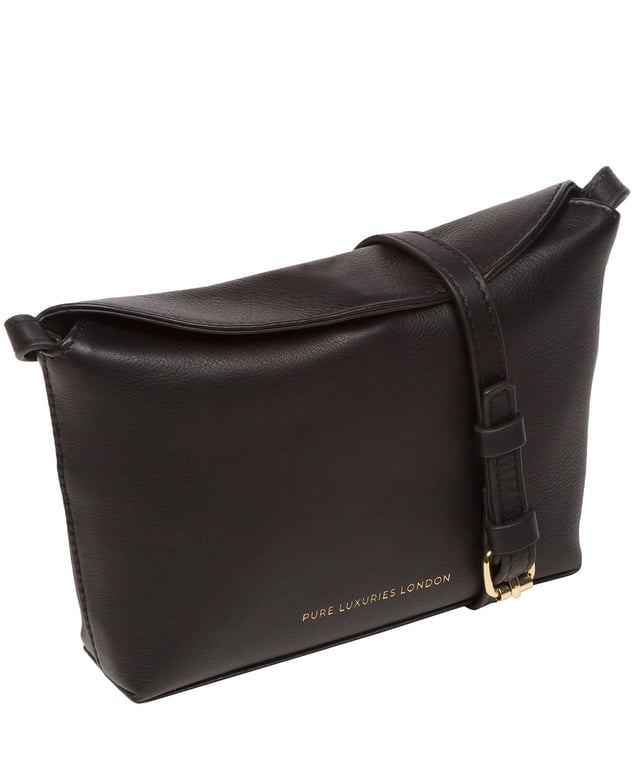 The 'Lolo' cross body bag from the Pure Luxuries Marylebone collection is handcrafted from high-quality, genuine Nappa leather with a natural super-soft touch. The bag is secured by a magnetic closure which opens to reveal a 100% cotton-lined interior and includes two slip pockets. Features gold-coloured metal fittings alongside the adjustable slim leather strap, with a maximum drop length of 65cm. The Pure Luxuries logo is embossed in gold foil for a beautifully simple finishing touch.