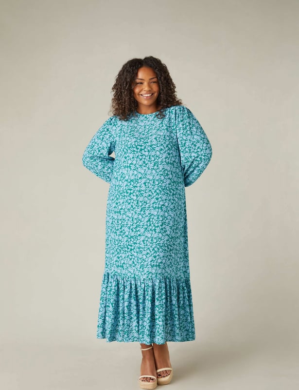 Printed all over with a beautiful ditsy print, this Midaxi dress is cut from a soft woven fabric that moves beautifully. It has a round neckline with a keyhole button at the back neck, as well as short blouson sleeves with elasticated cuffs. Its swingy midaxi shape is enhanced by a single tier at the hem, which gives it a relaxed, pretty silhouette.