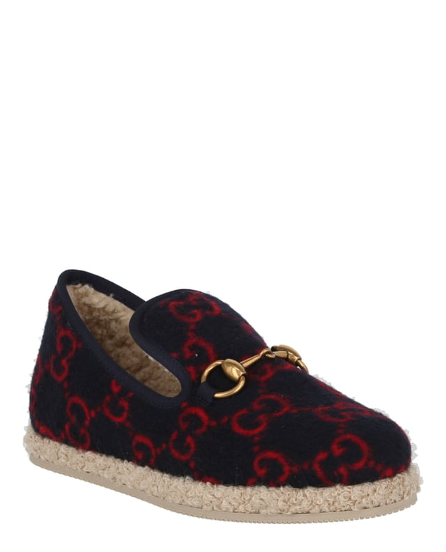 Heel measures at approximately: 0.4"; Slips on; 100% wool; Closed round toe,fur lining; Embellished with signature horsebit and knitted GG pattern;