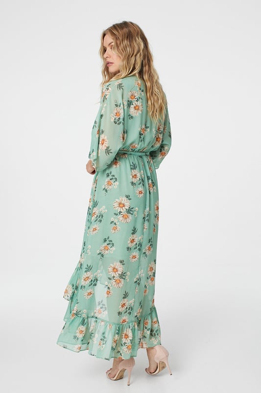 No warm weather collection is complete without a floral wrap dress. With a deep v-neck, batwing 3/4 sleeves with a semi sheer detail, a tie waist and a pephem midi skirt with a high low cut. Style with heeled wedges for an outdoor event or dress down for a sunshine break with sandals.