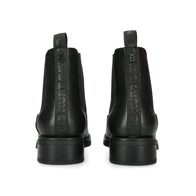 The KG Kurt Geiger Tiffany Chelsea boot features a black leather upper with two elasticated panels at the sides of the ankle. There is a KG Kurt Geiger tab at the back of the ankle with gunmetal stud on top.
