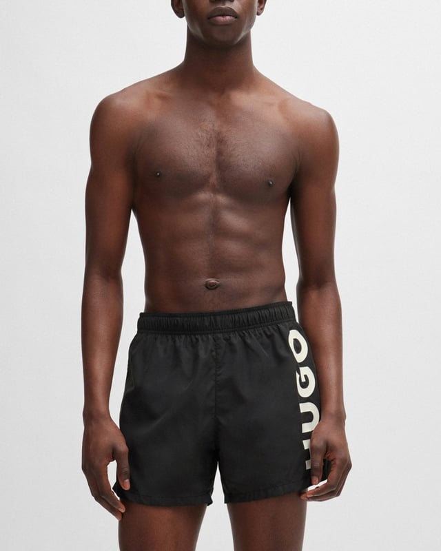 Modern swim shorts by HUGO. Designed in quick-drying fabric with full lining, this beach-ready pair features a vertical logo printed in contrast.
100% Polyester (recycled) , Lining: 100% Polyester
50513979