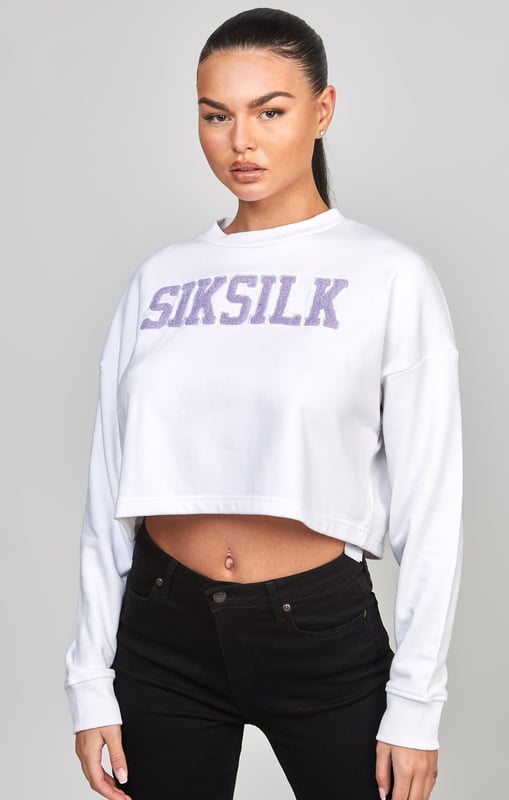 inchWhite Crop Varsity SweatshirtSoft touch fabricCropped fitEmbroidered logoCrew neckAppliqueLong sleeveMachine wash80% Cotton 20% Polyester Loopback inch