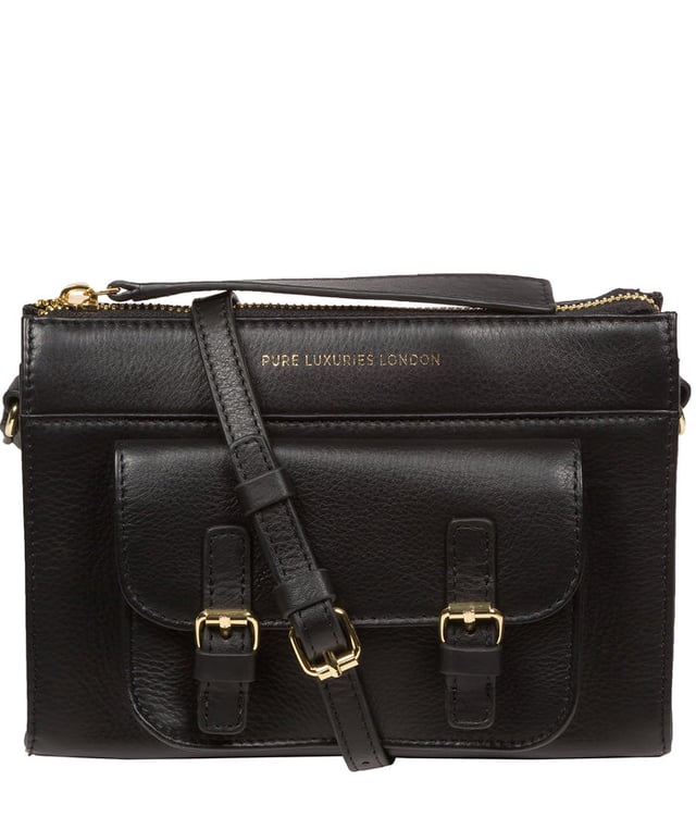 Handcrafted from Nappa leather, the 'Monica' cross body bag from the Pure Luxuries London Marylebone Collection elevates this classic design. A spacious main compartment is secured under a zip-over top which is lined with 100% cotton for a luxurious feel. Two slip pockets on the interior of the bag provide additional storage space - ideal for maintaining an organised accessory. Complementing the interior storage is a stylish pocket secured with a press-stud fastener made to look like a buckle reminscent of the classic satchel design. Gold-coloured metal fittings and zips adorn the bag alongside the slim and adjustable leather strap with a maximum drop length of 65cm. The Pure Luxuries logo is embossed in gold foil for a beautifully simple finishing touch.