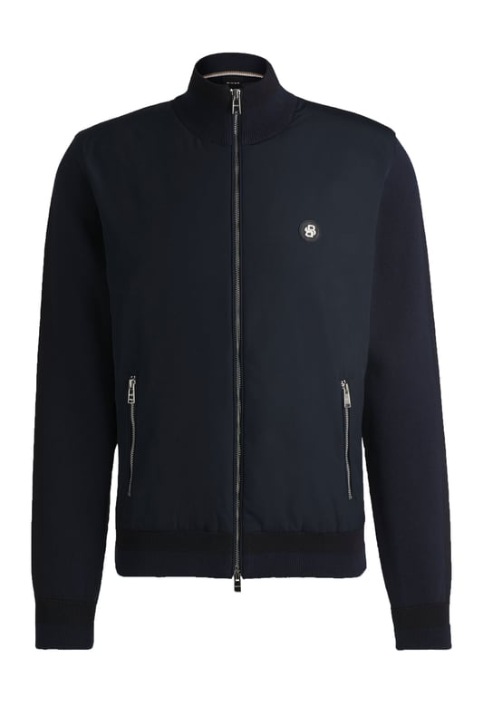 Boss C-Darmando Mixed-material Zip-up Jacket Dark Blue
 
A signature zip-up jacket, cut to a straight fit and crafted in mixed materials for ultimate style and performance. Finished with the all new double-monogram badge at the chest.

Regular fit
Ribbed cuffs
Standard length
Quality: 100% Cotton, Sleeve: 71% Cotton, 29% Polyester, Front panel: 100% Polyester, Front lining: 100% Polyester, Ribbing: 79% Cotton, 21% Polyester, Wadding: 100% Polyester (80% recycled)