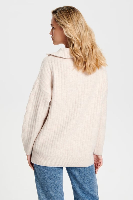 Gorgeous winter jumper in two luxurious soft colours. Great for casual looks, or paired with knee high boots for a contemporary stylish look. Super soft cable knit, in an oversize relaxed fit. Model wears a UK XS (is usually a size 8-10). Size down for a more fitted look.

Super soft chunky cable knit
72% Acrylic 25% Polyester 3% Elastane
Zip Neck with collar
26" Shoulder to Hem
Long Sleeve
Sizing: Run large for size
Fit: Oversized Boyfriend Fit