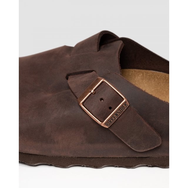 Men's Birkenstock Boston Leather Sandals in Brown Dating back to 1774 and originating from Germany BIRKENSTOCK is globally known for their signature footwear styles influenced by two and a half centuries of brand history. Providing comfort and durability they present these mens Boston Leather Slip On Shoes featuring their signature Birko-Flo skin-friendly material. Details: brown colourway adjustable buckle strap round toe cork footbed leather upper tonal stitching and embossed branding to side to complete.