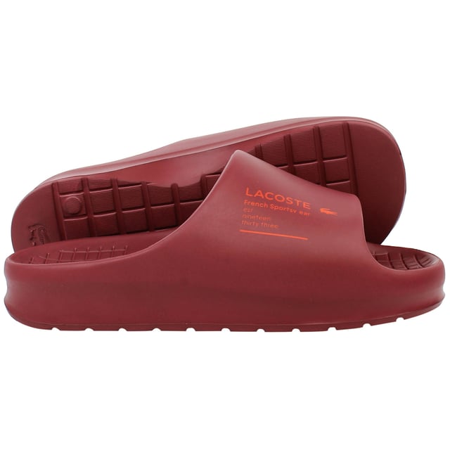 The Lacoste Serve Slide 2.0 223 2 CMA Men's Red Sliders deliver bold style and everyday comfort, making them an essential choice for casual wear, poolside relaxation, or beach outings. With their vibrant design and premium construction, these sliders offer practicality and flair.
Â 
Key Features:
Ergonomic Footbed: 

Contoured for superior comfort and support, providing a comfortable fit for extended wear.


Durable Synthetic Strap: 

Features the iconic Lacoste crocodile logo embossed for a sporty and stylish look.


Slip-On Design: 

Ensures easy on-and-off wear, making them perfect for leisure and quick outings.


Textured Rubber Outsole: 

Offers reliable grip and traction on various surfaces, even in wet conditions.


Lightweight Construction: 

Reduces fatigue, ensuring comfort for all-day use.


Water-Resistant Materials:

Designed to withstand exposure to water, making them ideal for pool or beach environments.


Bold Red Colorway: 

A striking and energetic design that adds a vibrant touch to your casual wardrobe.


Â 
The Lacoste Serve Slide 2.0 223 2 CMA Men's Red Sliders combine comfort, durability, and a bold aesthetic, making them a go-to option for relaxed and stylish footwear. Perfect for vacations, lounging, or adding a pop of color to your everyday look.
Â 
Â 
Â 