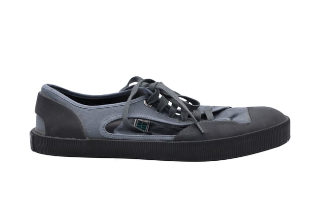 VINTAGE, RRP AS NEW
Lanvin takes innovation to the next level.  These sneakers made of canvas features an open side for a more breathability.  This elaborately constructed shoe stands for it's unique style.  Wear a funky pair of socks with this shoe to be fun and to have an eccentric style. 
Lanvin Open Low-top Sneakers in Grey Canvas
Condition: Very Good
Sign of wear: Wear on the soles
Material: Canvas/Rubber
Color: grey
Size: UK6/US7/40
SKU: 127105
