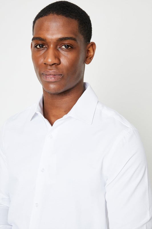 Slim fit shirt tailored for a sharp silhouette
cavalry twill fabric for a smart look
Easy iron finish for effortless maintenance
Spread collar for a refined appearance
Long sleeves with buttoned cuffs

Exuding sophistication, this slim fit shirt from Burton is a versatile choice for smart casual occasions. The cavalry twill fabric and easy iron finish ensure a polished look with minimal upkeep. Pair it with chinos or tailored trousers for a refined yet relaxed ensemble, perfect for after-work drinks or weekend brunches with friends. The spread collar and buttoned cuffs add a touch of elegance, making it an ideal option for more formal events as well.