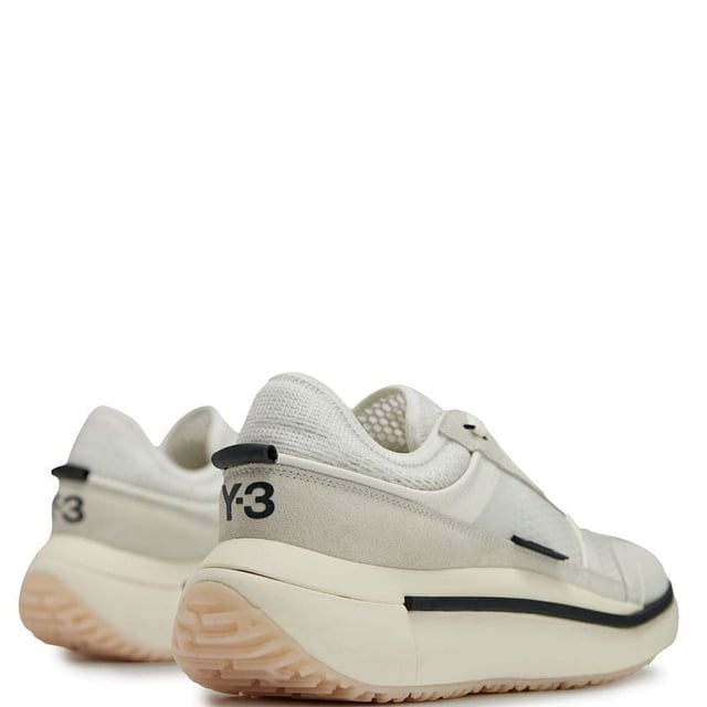 Mens Y-3 Ajatu Run Trainers in white.- Suede  double-layer textile and mesh upper.- Lace closure.- Lightstrike cushioning.- Collapsible feel.- Suede and mesh lining.- Rubber outsole.- Ref: GW8614