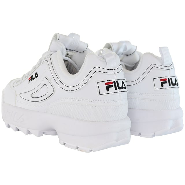 The Fila Disruptor Kids White Trainers are a classic and stylish choice for children's athletic and casual footwear. Here's a description of the key features:

 White Design:  These trainers come in a clean and timeless all-white color, making them a versatile and fashionable option that can be easily paired with a wide range of children's outfits.

 Chunky Sole:  One of the standout features of the Fila Disruptor series is the chunky and exaggerated sole design, which provides a distinctive and bold look.

 Leather Upper:  These trainers are typically constructed with a durable leather upper that offers both style and longevity, ideal for active kids.

 Padded Collar and Tongue:  The trainers usually come with a padded collar and tongue for added comfort and support around the ankles, which is important for kids.

 Lace-Up Closure:  They feature a traditional lace-up closure, allowing for a secure and customizable fit.

 Fila Branding:  You can expect to find the Fila logo and branding prominently displayed on these trainers, showcasing their authenticity and quality.

 Traction Outsole:  The trainers often have a durable and grippy rubber outsole, ensuring stability and grip on various surfaces, which is crucial for active children.

In summary, the Fila Disruptor Kids White Trainers are a fashionable and reliable choice for children who want a distinctive and stylish look in their athletic and casual footwear. The chunky sole design and classic all-white color make these trainers stand out, and the combination of leather and padded elements provides comfort and durability. Fila's iconic branding and quality are showcased in this model, making it an excellent option for parents looking for both style and functionality in their children's footwear.