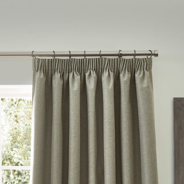 Transform your living space with Dawn Blackout Pencil Pleat Curtains, designed for those who value elegance and practicality. Crafted from soft-textured fabric with a modern marl effect, these curtains add refined style to any room while effectively blocking out light. Perfect for a restful night's sleep or creating the ideal movie-watching environment, their temperature-regulating properties ensure comfort year-round by keeping your home cool in summer and warm in winter. Enjoy the perfect blend of function and style with Dawn Blackout Curtains.