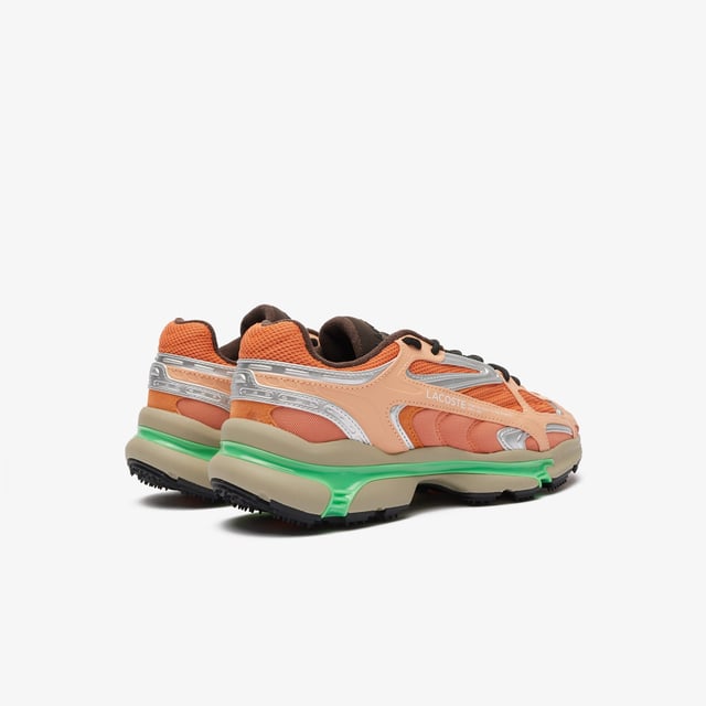 The L003 2K24 is the step to the future of Lacoste sneaker design language. This sneaker is built for today’s fashion-sneaker connoisseur - harnessing sport  style and tech features for a fresh and unique design aesthetic. The sporty mesh upper is layered with suede and multiple embossed metallic leather panels  harnessed by an outer cage which features the Lacoste Active branding details. The light EVA midsole features a dynamic shiny TPU stabiliser for support and stability together with a textured rubber outsole. • Progressive Running Sneaker • Breathable Mesh Upper with Synthetic overlays • Synthetic metallic panels with embossed detailing • Outer Synthetic Leather Cage design printed with Active Branding • EVA midsole with TPU support • Textured rubber outsole • Rounded rope laces • Mesh lining