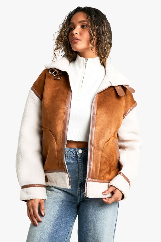 Take your outfit to new style heights with an aviator jacket. Perfect for layering, create a stylish oversized silhouette as you choose from crop belted jackets to faux fur lined options. A cross between a classic flight jacket and a leather biker, it's all about the detailing with this snug winter staple. Pair your aviator coat with high waisted mom jeans or a mini skirt with tights and boots - the options are endless...Style: Aviator Jacket