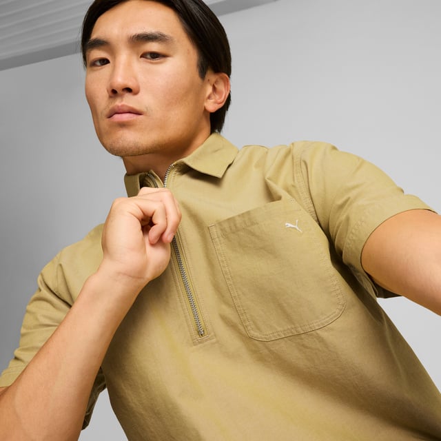 PRODUCT STORY: MMQ = "Macht's mit Qualität." Translated from German, it means "Made with Quality" and represents the finest in PUMA's designs and materials. Minimalistic aesthetics, contemporary silhouettes, with a passion for sophisticated details. This shirt has a relaxed fit and a half-zip closure. FEATURES & BENEFITS: Made with at least 20% recycled cotton. DETAILS: Relaxed fit; 210 gsm, plain weave; Collar; Short sleeves; Half-zip closure with metal zip pull; Chest pocket.