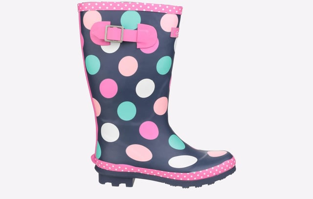 Perfect for the upcoming months, these Cotswold Dotty wellingtons are perfect for taking the rainy weather in stride and making a splash. The waterproof rubber upper is constructed in a classic wellington silhouette, with a deep navy colourway adorned with fun multi-coloured dots and a chic pink trim sure to brighten up your little ones day no matter what the weather. The slip-on design ensures easy on / off wear, with an adjustable buckle feature to the side for the perfect fit and feel. A soft textile lining and padded footbed provide comfort, with a durable rubber outsole and cleated heel for enhanced traction, making them a wardrobe essential for the upcoming months. 
 - Waterproof rubber outsole
 - Adjustable buckle feature
 - Textile lined with removable insole
 - Cushioned footbed
 - Slip on design
 - Rubber traction sole unit with chunky cleated heel
 - Cotswold branding
 *Do your bit for the environment as every pair of these Cotswold Shoes sold supports National Forest tree planting.*
 Please note: These boots come in a branded Cotswold bag and are not boxed.