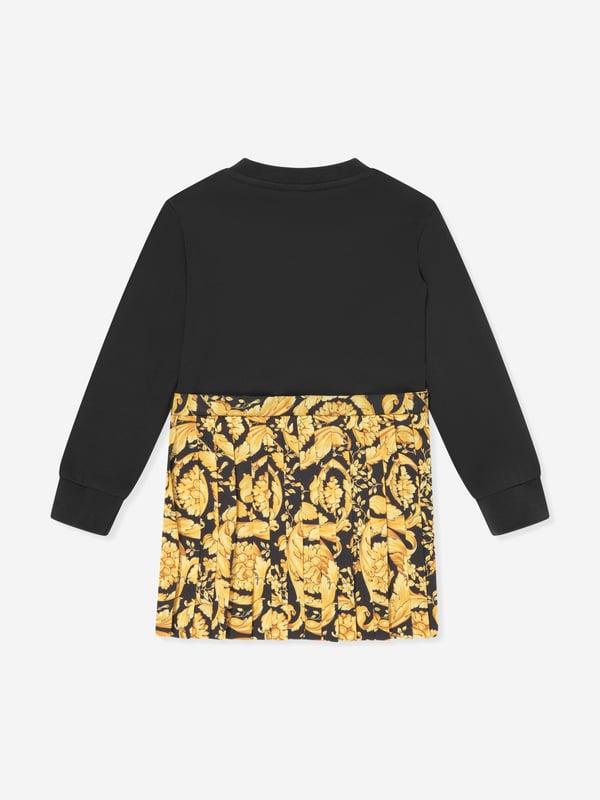 Versace envision bold, innovative abstracts in their beautifully haute couture abstracts. This baby girls black sweater dress encapsulates the Italian label's passion for daring and unparalleled technology. Envisioned in soft, stretchable knit fabric via a yellow and black striking baroque motif. It showcases an embroidered logo on the left wrist with a satin skirt that has a slight ruching/pleating effect. ‚ Long Sleeves‚ Round Neckline‚ Black Embroidery ‚ 100% Cotton