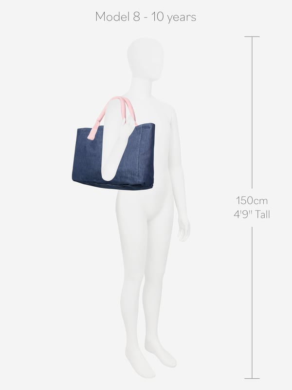 Carry life's essentials in style with this blue tote bag from AY by Ayla. The denim style piece exhibits a chic demeanour, elevating any look. Pink fleece handles are soft on skin and create a cute contrast. Pair with any other AY blue or pink garments for a cool coordinated look.