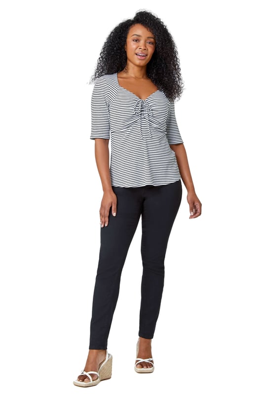 Petite Stripe Ruched V-Neck Stretch Top from Roman. Embody daytime glamour with this timeless Petite piece! Our newest addition to the Petite collection is this cutesy stripe top, it features a unique sweetheart neckline and playful 3/4 length sleeves that are sure to make a versatile staple ready for your Spring wardrobe. This Petite top has a timeless ribbed texture which accompanies the stripe print throughout as well as a tie detail at the bust that provides a sophisticated flare. Wear with shorts and sandals for a holiday-ready style.