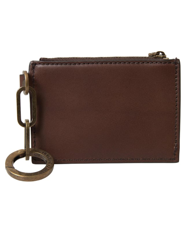 100% läder\n  Dragkedjeförslutning\n  Nyckelring ingår\n  Dolce \u0026 Gabbana-logotypdetaljer\n  Tillverkad i Italien\n  Mått: 11 cm x 8 cm x 2 cm\nMaterial: 100% läder