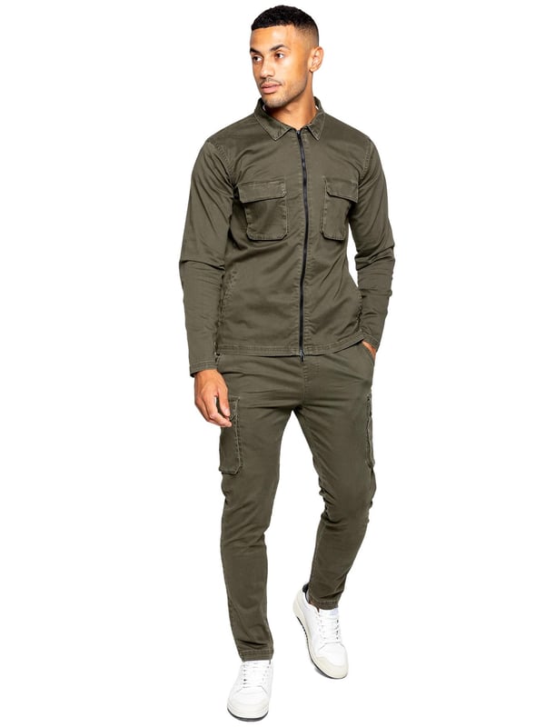Enzo Mens Cargo Outfit Set. Long Sleeved, Zip Up, Collared, Cargo Overshirt. Two Front Flat Cargo Pocket With Velcro Fastening. Two Side Welt Pockets. Stitched Trims On Sleeves And Hemline. Set Completed With Cargo Trousers. Regular Fit, Straight Leg, Enzyme Wash. 5 Pocket Design. 2 Side Pockets, 2 Cargo Pockets With Velcro Fastening. Single Back Welt Pocket. Elasticated Waistband With Adjustable Drawstring
